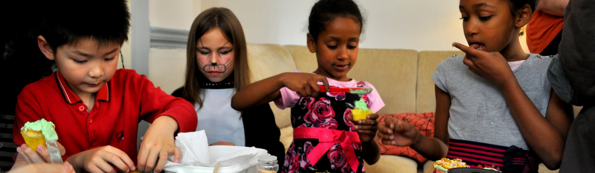 Children playing with baking equipment