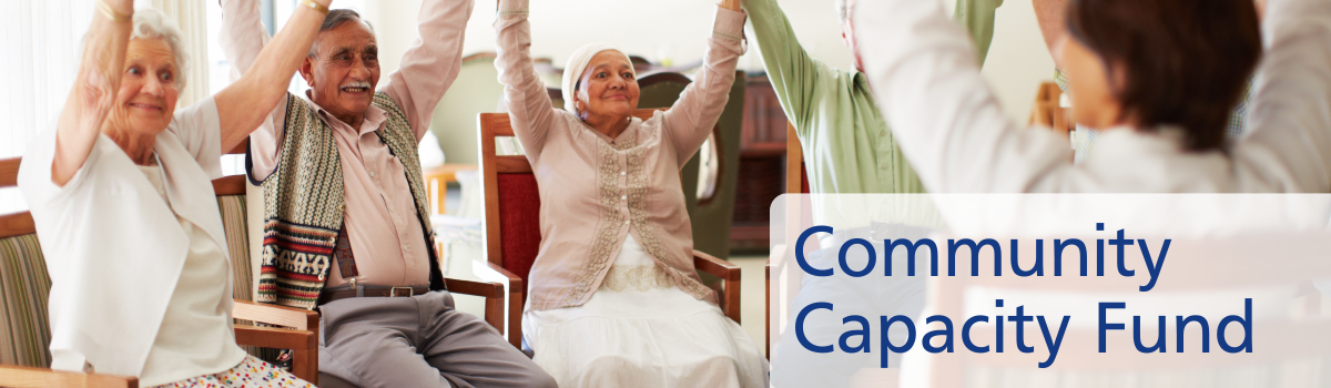 Elderly people doing seated exercise