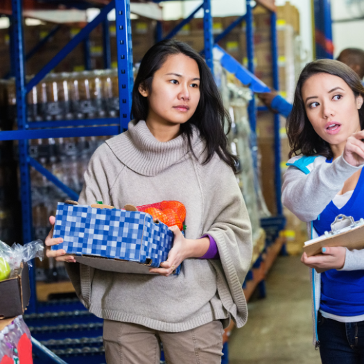 Food bank 810×525 Two people working in a food bank