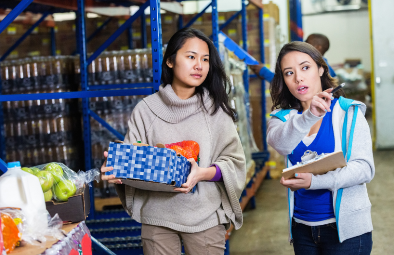 Food bank 810×525 Two people working in a food bank