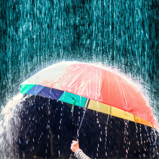 Building resilience 810×525 An umbrella being held in a rain storm