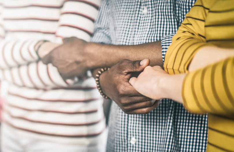 Community Capacity news article 810×525 (1) Three people are holding hands