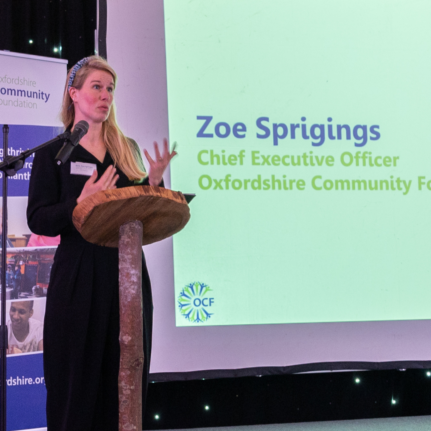 Uncovered speeches news article 810×525 (1) Zoe Sprigings, CEO at OCF standing at a lecturn and speaking.