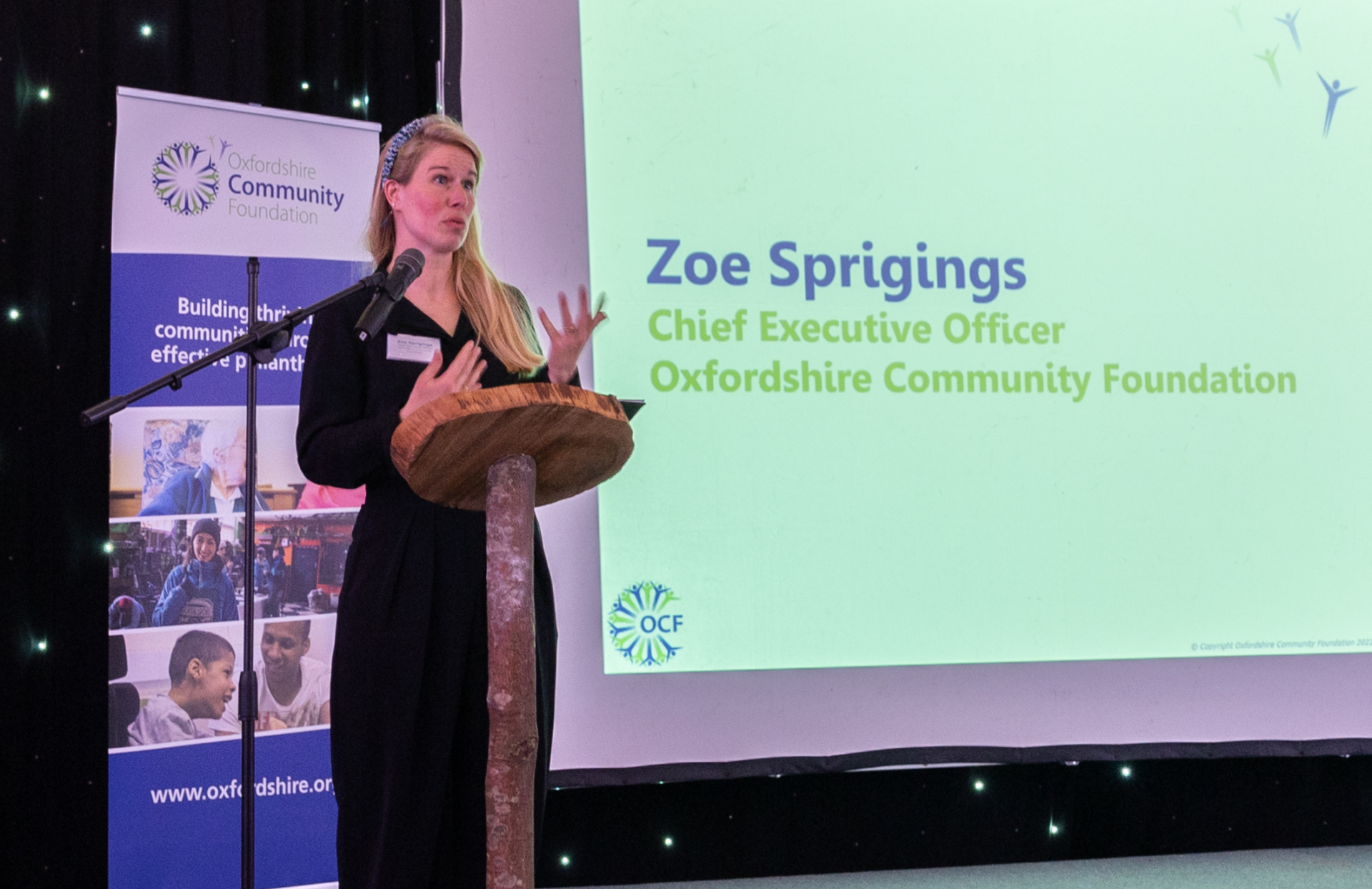 Uncovered speeches news article 810×525 (1) Zoe Sprigings, CEO at OCF standing at a lecturn and speaking.