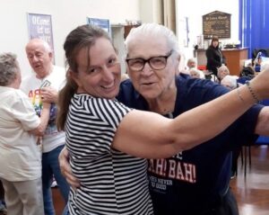 A man and woman dancing together and having fun.